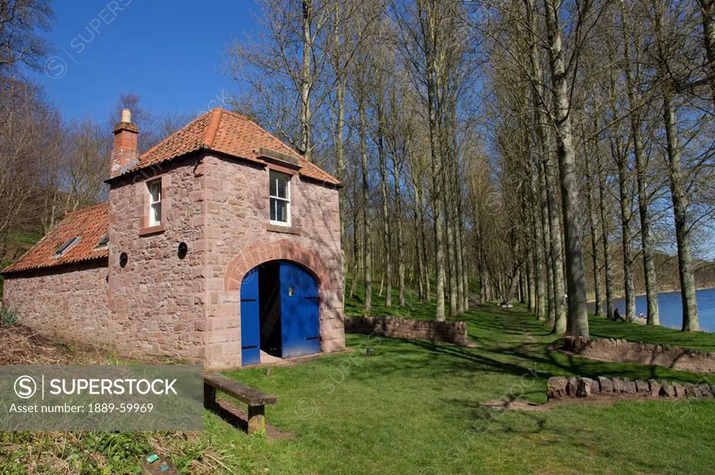 Paxton, Northumberland, England, A Shed With A Blue Door By The Water