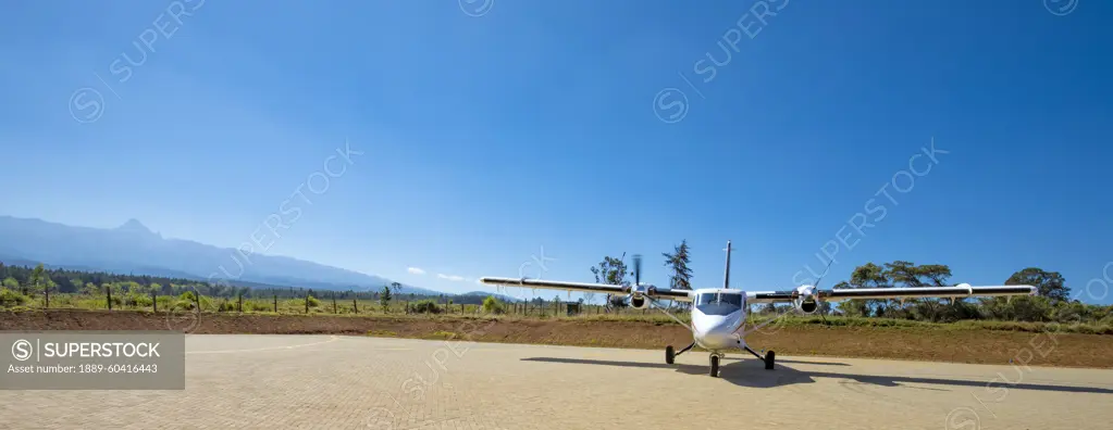 Air Kenya plane on airstrip at Mount Kenya, Nyeri County, near Nanyuki, Kenya; Nanyuki, Nyeri County, Kenya