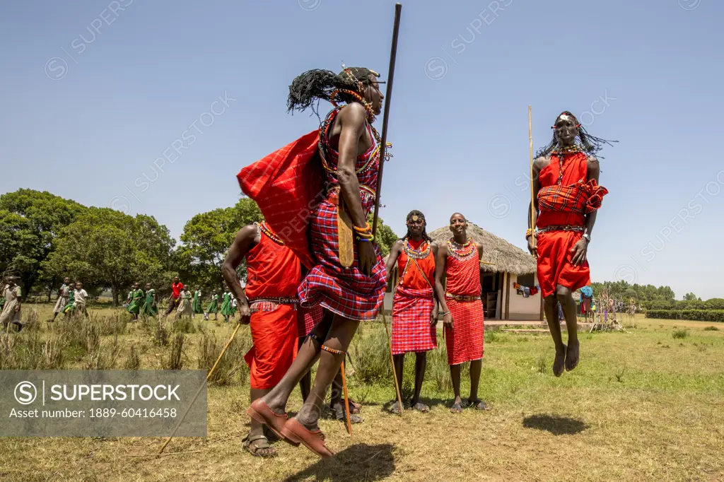 Maasai dancers in the Maasai Mara National Reserve, Kenya, Africa; Narok, Narok County, Kenya