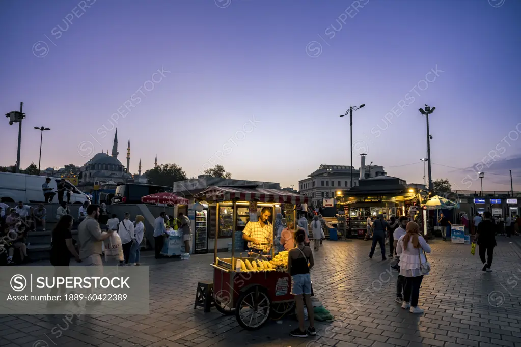 Street vendor in Eminonu Square at night in Fatih, Istanbul; Istanbul, Turkey