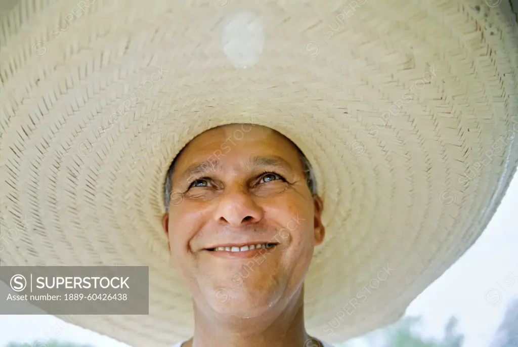 Brazilian man wearing a large brimmed hat; Pantanal Region, Brazil