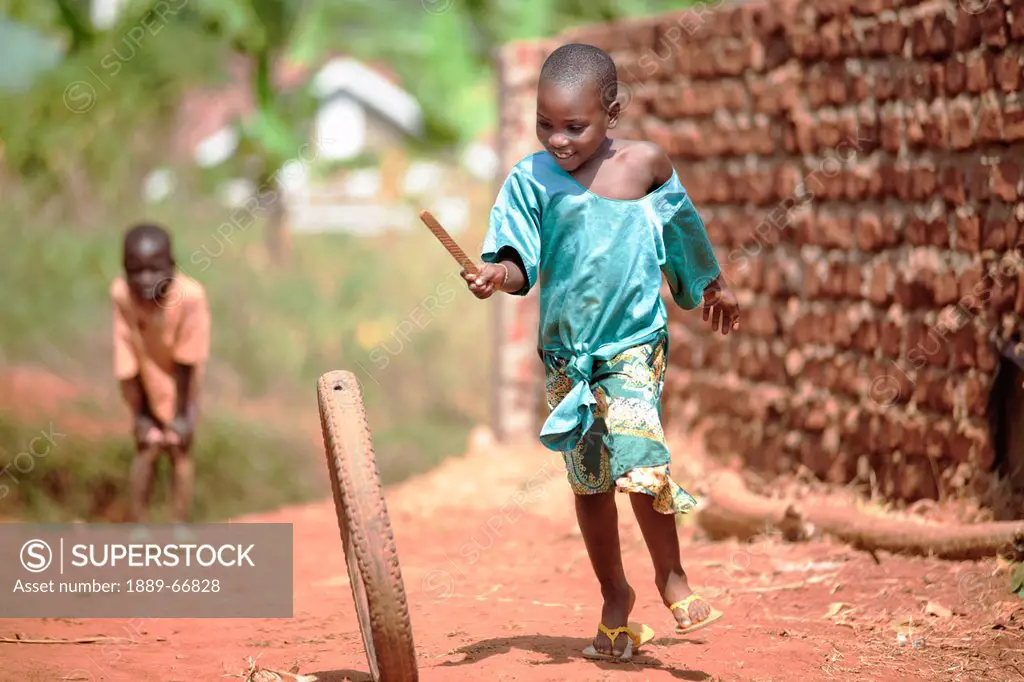 Ugandan Children Playing With Tire, Kampala Uganda Africa