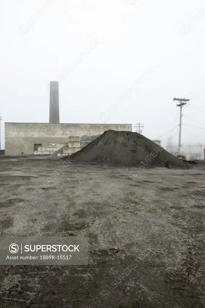 Gravel piled up by a building