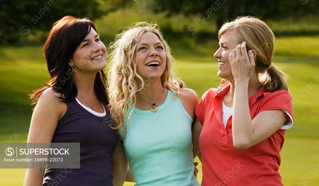 Three women enjoy a laugh