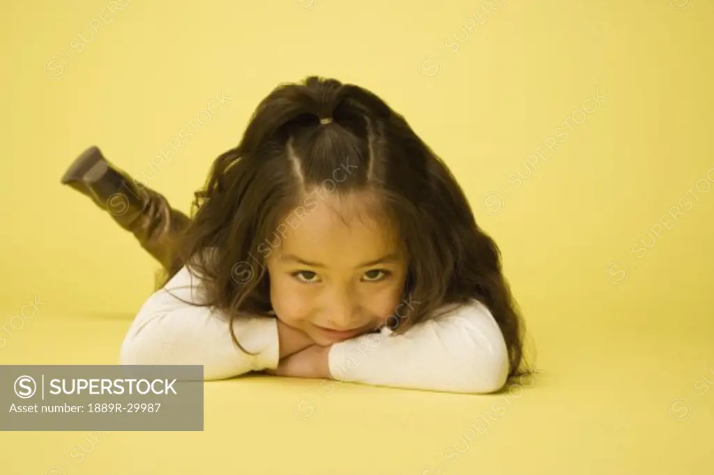 Little girl laying on tummy