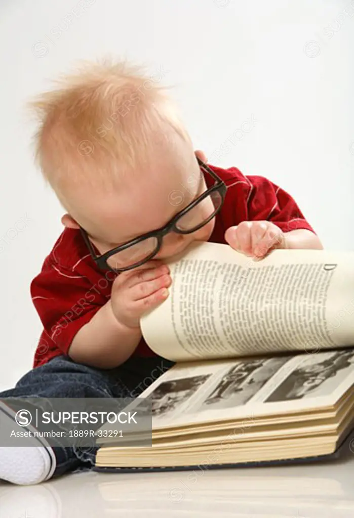 Baby chewing on a book