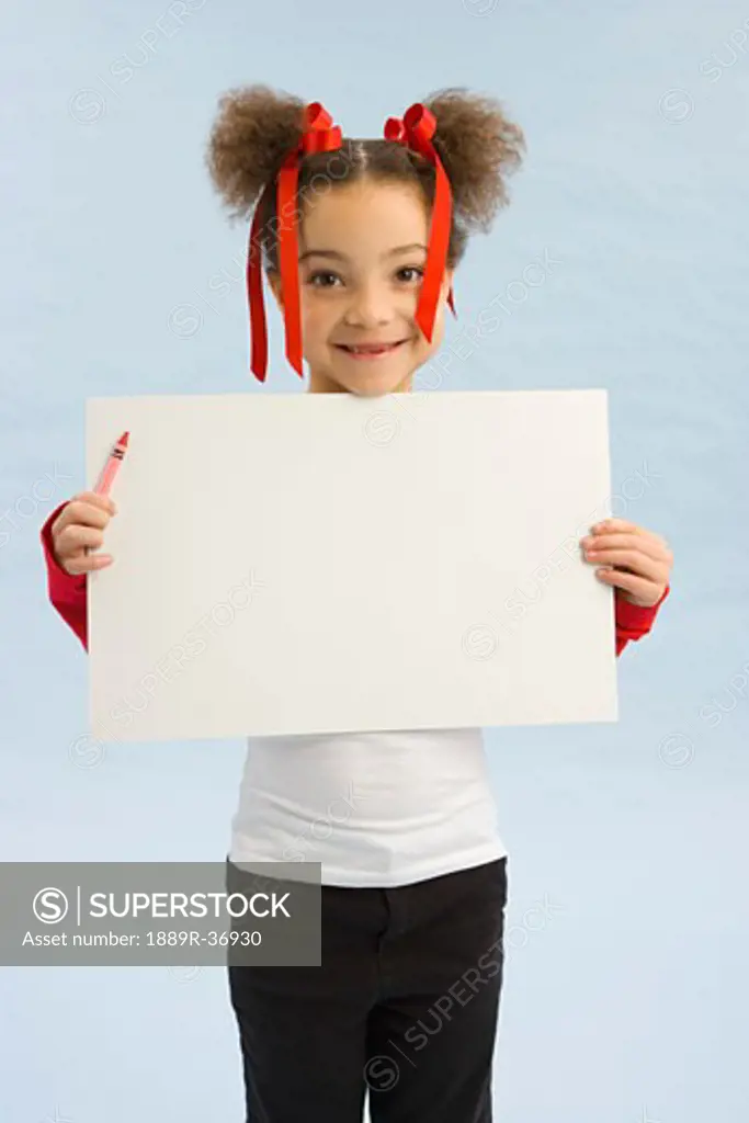 Girl holding up a book