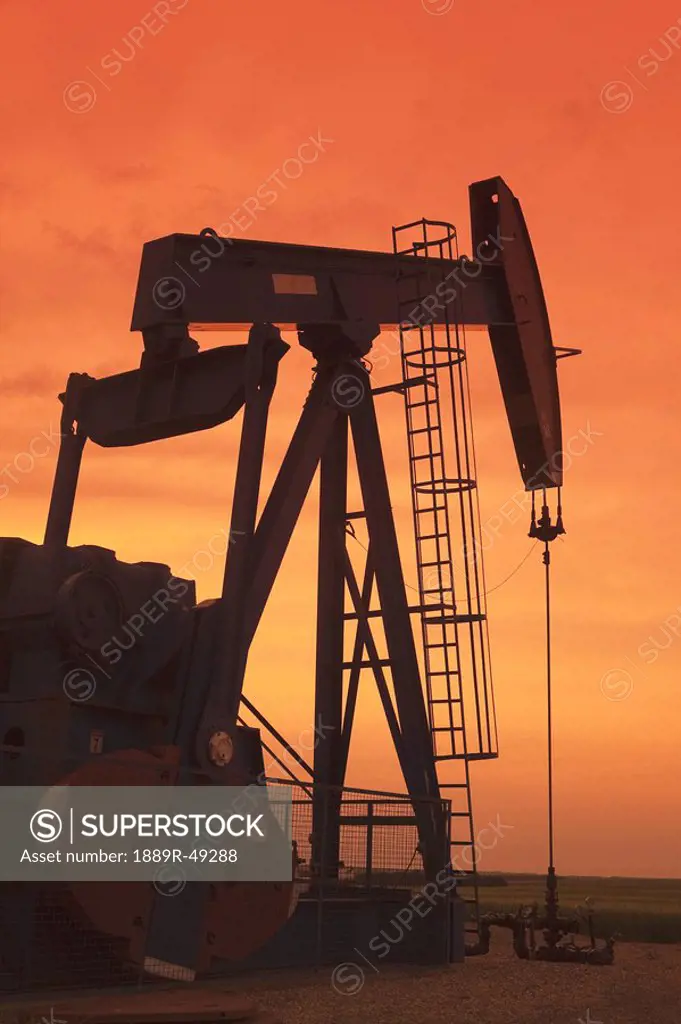 Pump jack at sunset