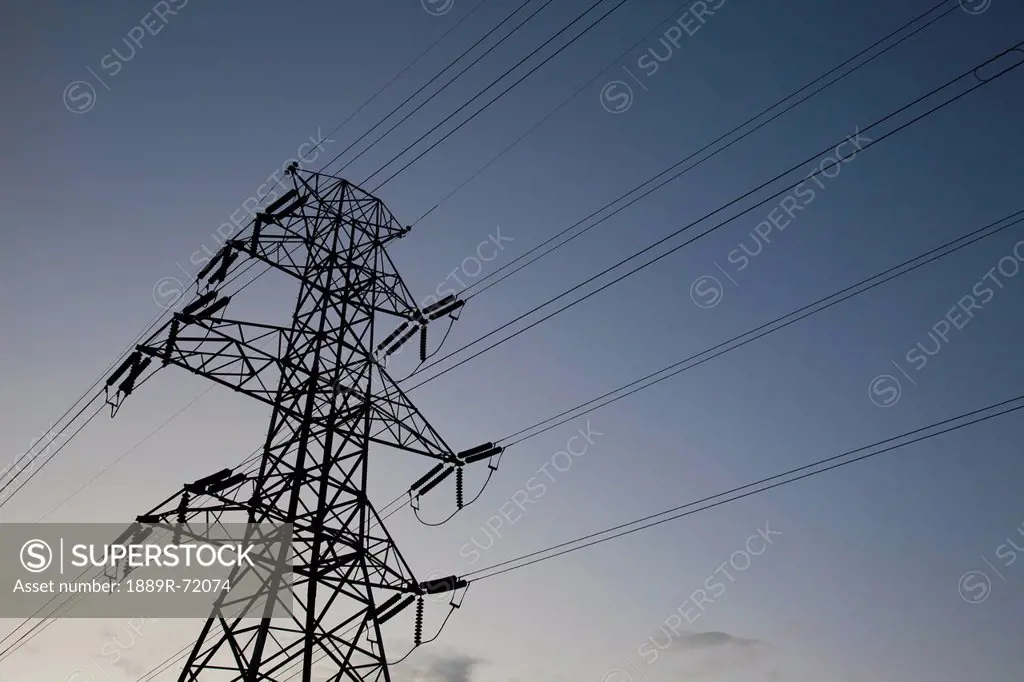 power transmission lines at dusk beaumont alberta canada SuperStock