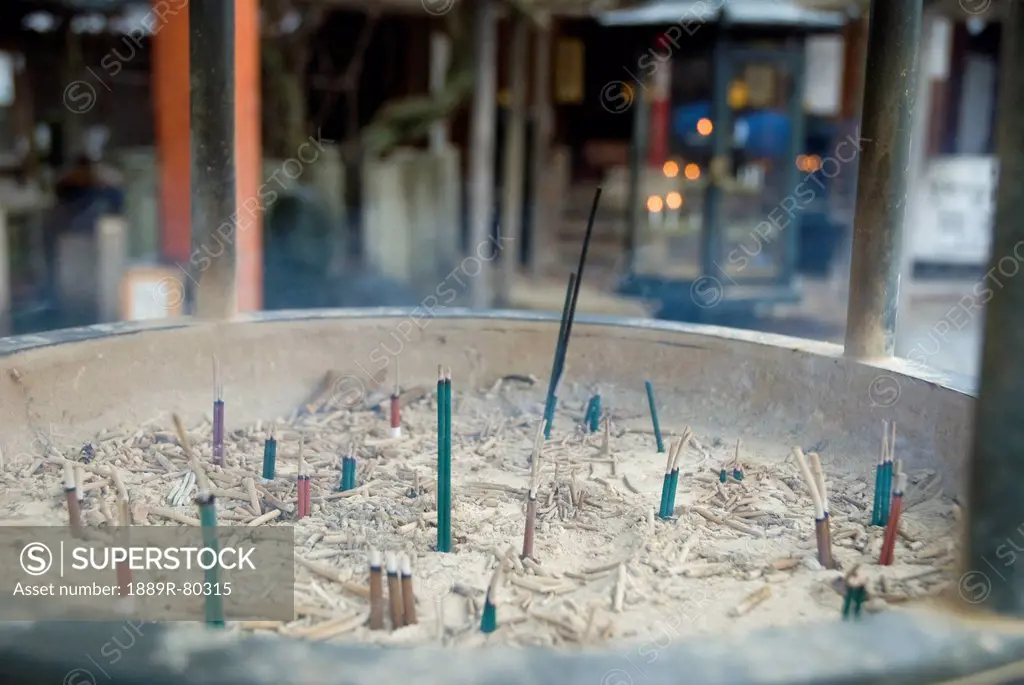 Close_up of a purification incense bowl at the entrance of a japanese temple, kyoto, japan