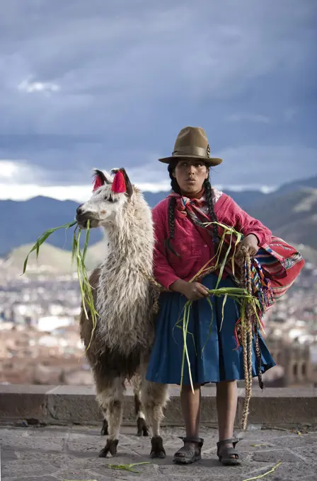 Peruvian Woman With Her Llama (Lama Glama), Cuzco, Peru