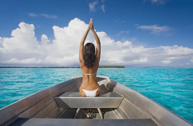 French Polynesia, Tahiti, Bora Bora, Woman Sitting In Boat.