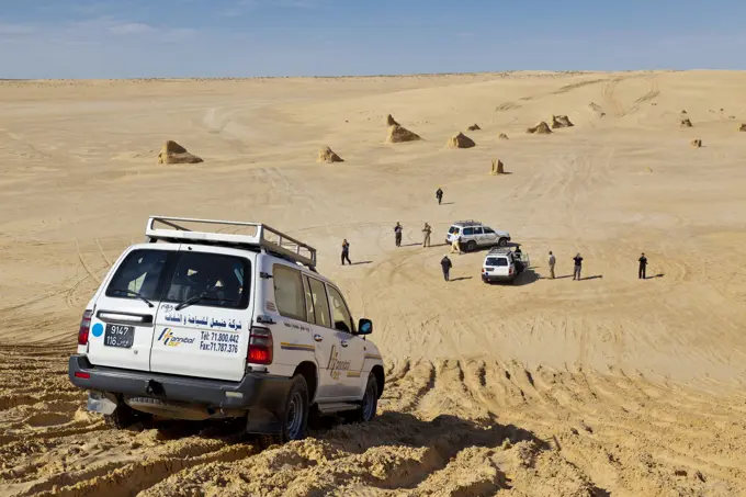 Tourists Exploring The Desert In 4X4 Vehicles; Tunisia, North Africa