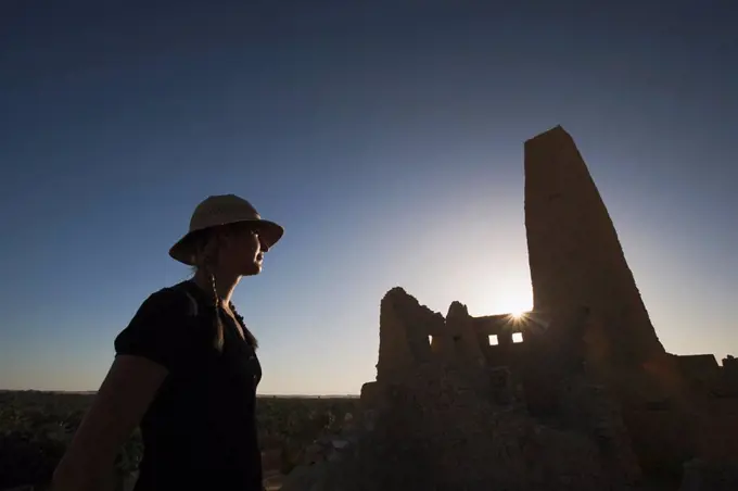 Woman tourist at The Temple of the Oracle Temple of Amun, Siwa Oasis, Egypt