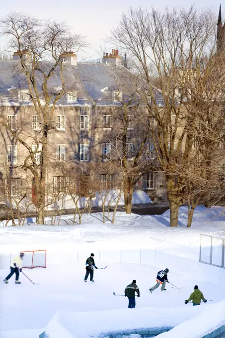 People Playing Hockey On An Outside Skating Rink In Winter, Quebec City