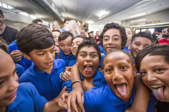 A goofy photo with local Maori schoolchildren in Galatea, New Zealand; Marupara, Bay Of Plenty, New Zealand