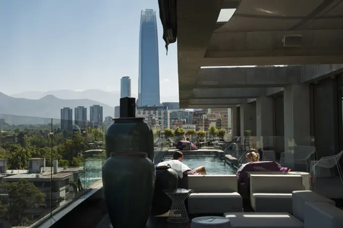 Hotel with rooftop pool and a view of the Great Santiago Tower; Santiago de Chile, Chile