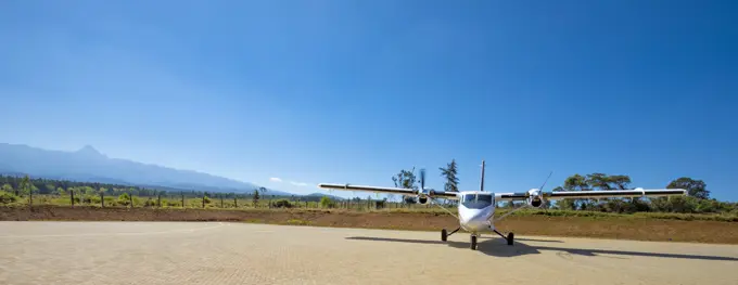 Air Kenya plane on airstrip at Mount Kenya, Nyeri County, near Nanyuki, Kenya; Nanyuki, Nyeri County, Kenya