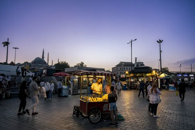 Street vendor in Eminonu Square at night in Fatih, Istanbul; Istanbul, Turkey