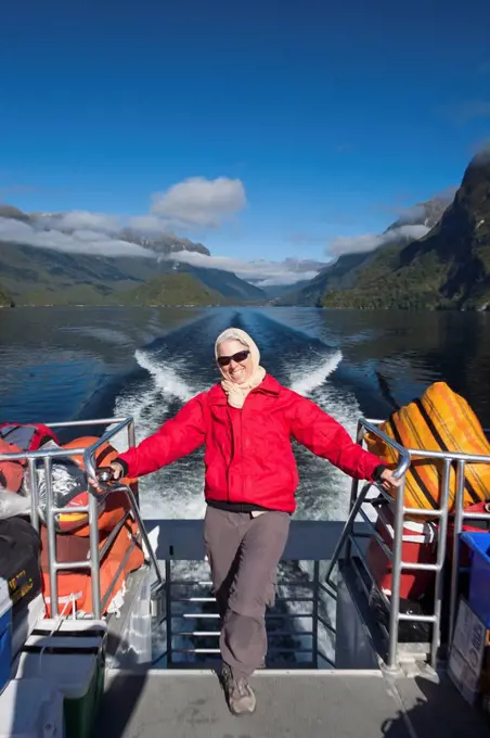 A Traveler Enjoying A Scenic Boat Cruise On Lake Manapouri To Doubtful Sound; New Zealand