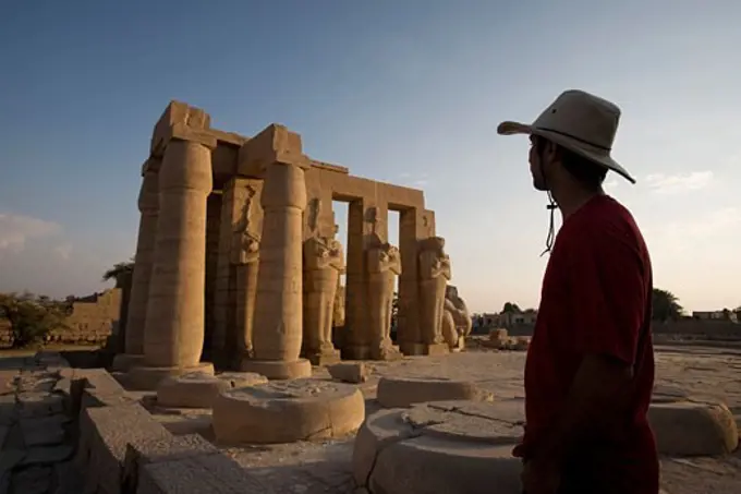 Luxor, Egypt; A tourist enjoying the view of the Ramesseum