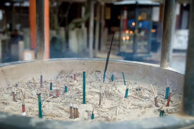 Close_up of a purification incense bowl at the entrance of a japanese temple, kyoto, japan