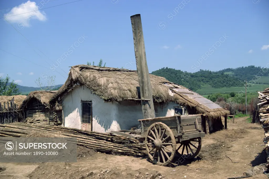 Typical rural house with straw roof in China, Asia