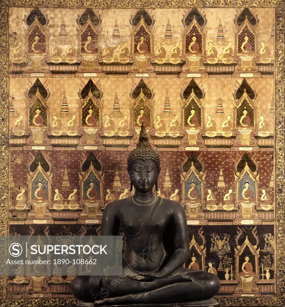 A 15th century Buddha image dating from the Sukhothai period in front of a Buddhist banner, Rangsit Collection, Bangkok, Thailand, Southeast Asia, Asi...