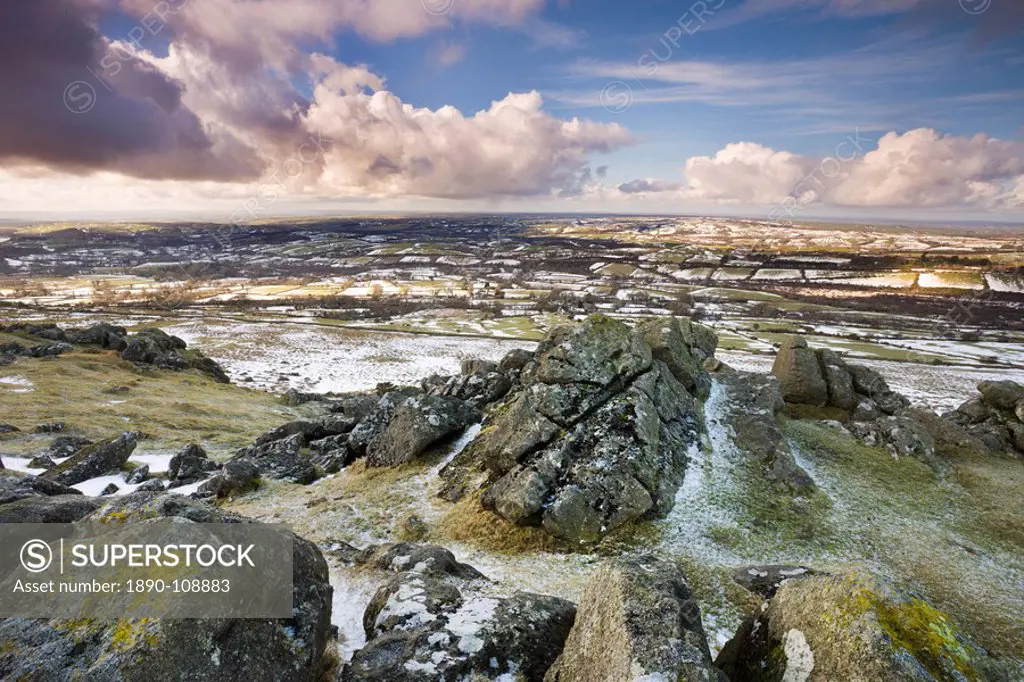 Sourton Tor backed by snow dusted countryside in winter, Dartmoor National Park, Devon, England, United Kingdom, Europe