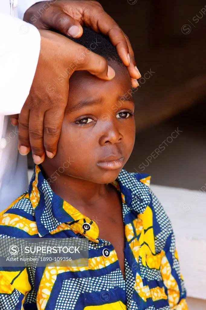 African child blessed by a priest, Lome, Togo, West Africa, Africa