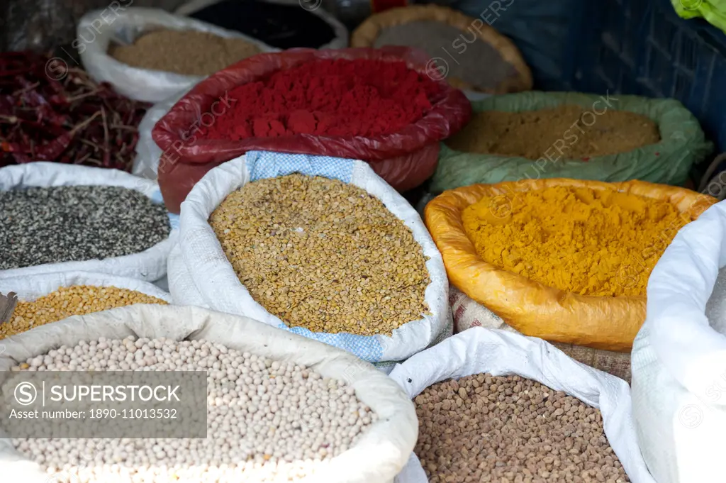 Pulses and spices in sacks for sale in Tizit village weekly local market, Nagaland, India, Asia