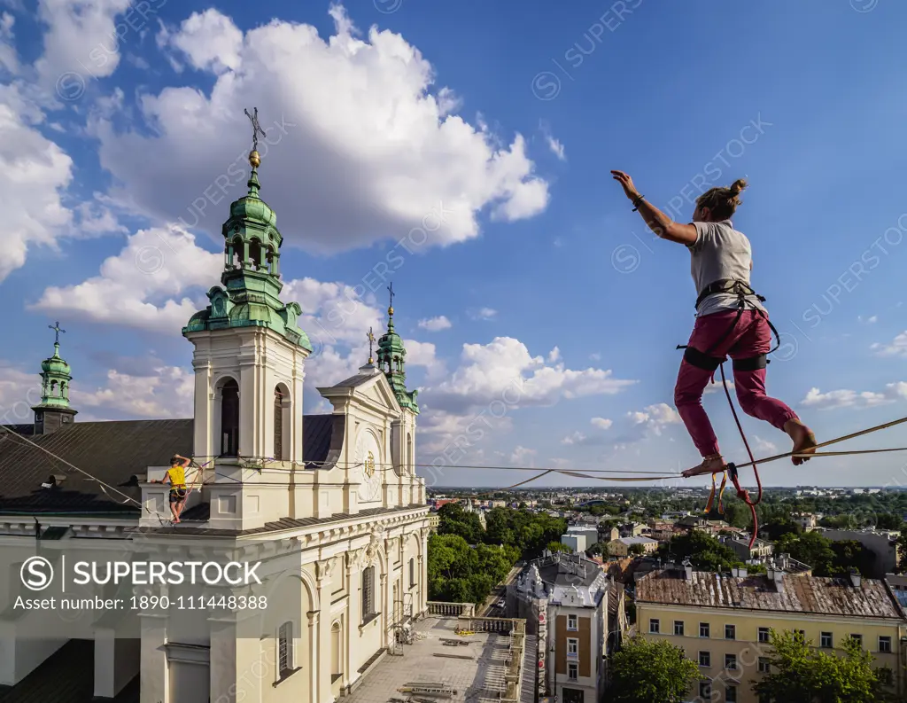 Highlining with Cathedral in the background, Urban Highline Festival, Lublin, Lublin Voivodeship, Poland, Europe