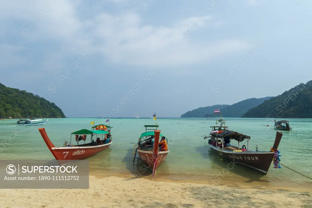 Three long tailed boats on a sandy beach, Thailand, Southeast Asia, Asia