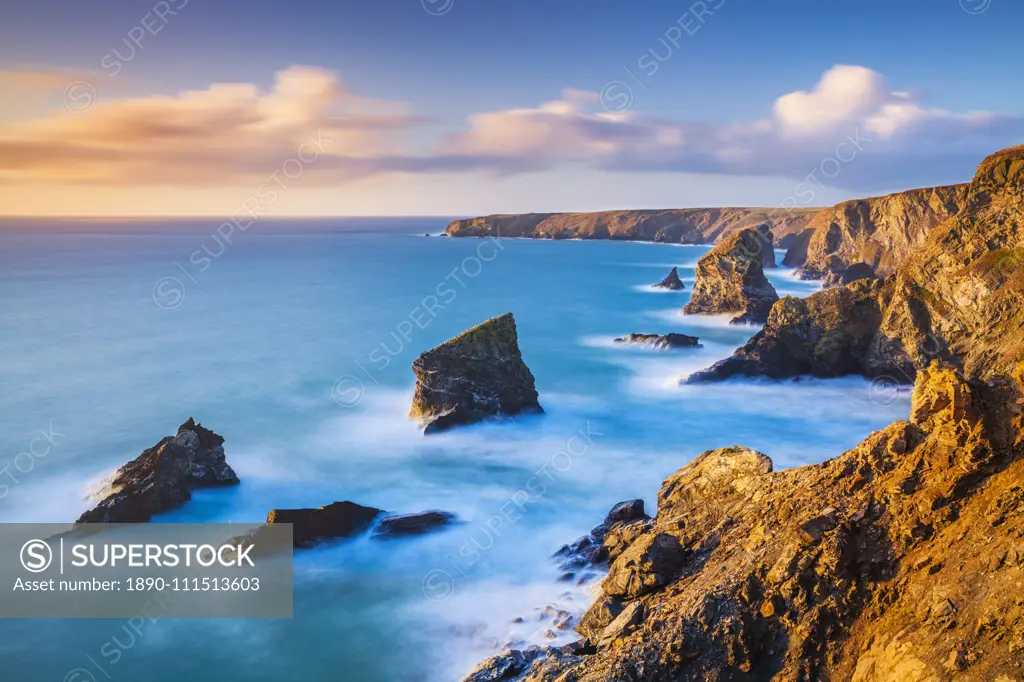 Sunset, Bedruthan steps sea stacks at high tide, Carnewas, Bedruthan, North Cornwall coast, Cornwall, England, United Kingdom, Europe