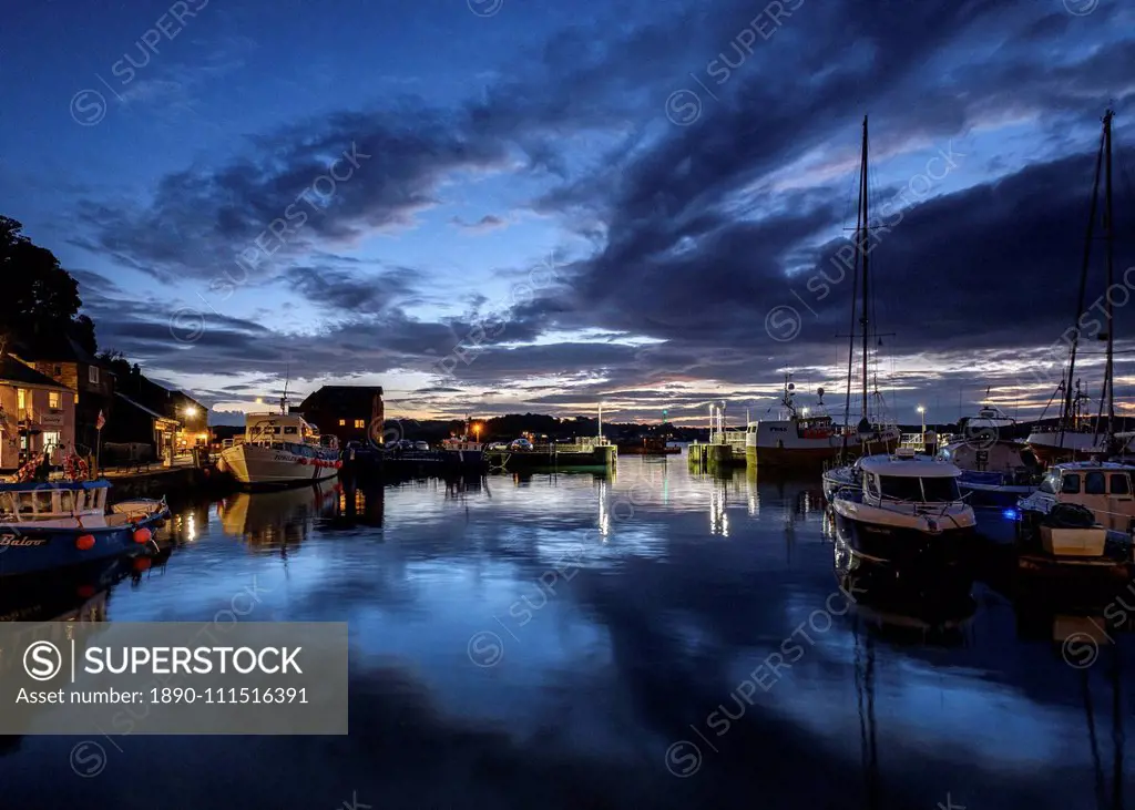 Boats and lights in the harbour of the popular fishing port of Padstow, Cornwall, England, United Kingdom, Europe