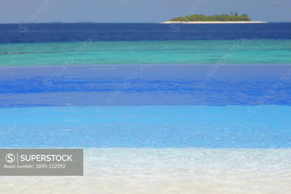 Swimming pool and tropical island, Maldives, Indian Ocean, Asia