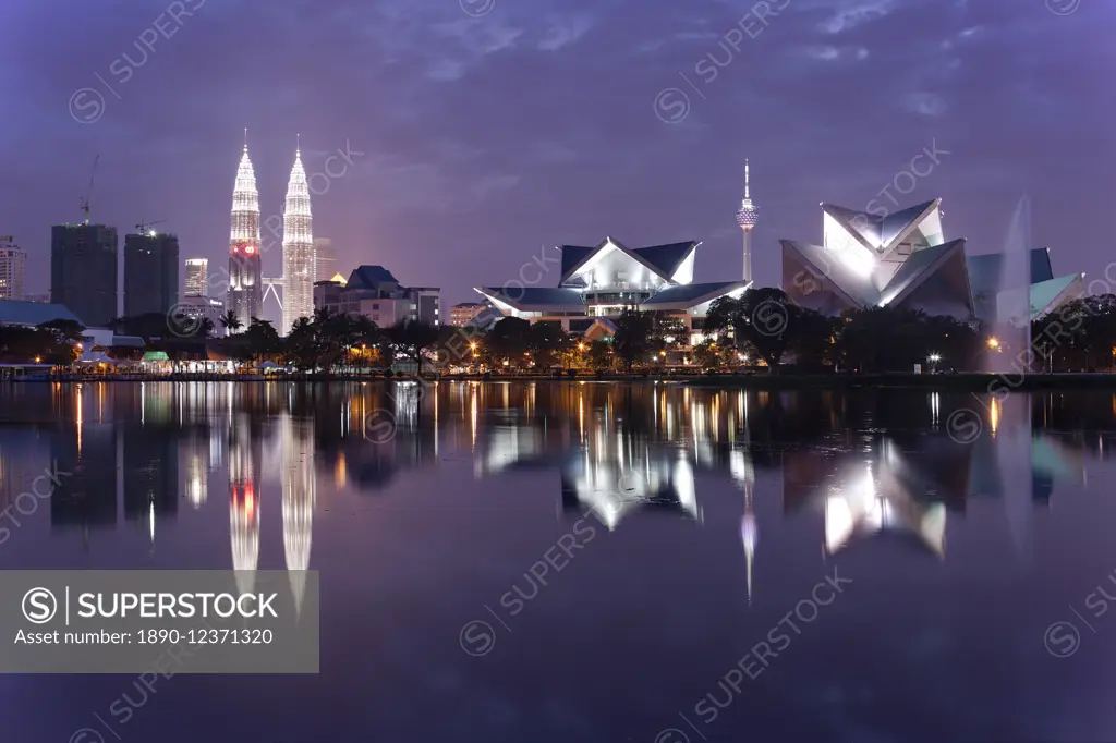 The remarkable Kuala Lumpur skyline, reflected in a lake at Titiwangsa in Kuala Lumpur, Malaysia, Southeast Asia, Asia