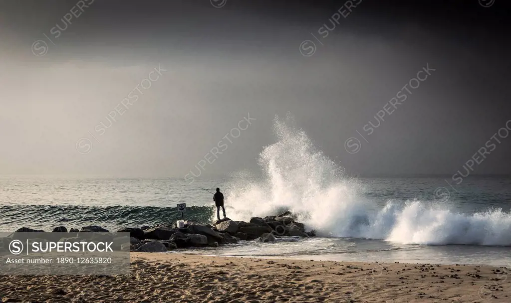 Early morning fisherman on Will Rogers Beach, Pacific Palisades, California, United States of America, North America
