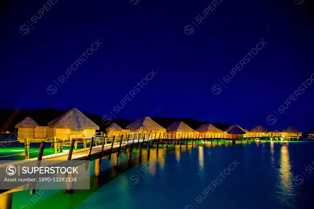 Overwater bungalows at night, Le Taha'a Resort, Tahiti, French Polynesia, South Pacific, Pacific