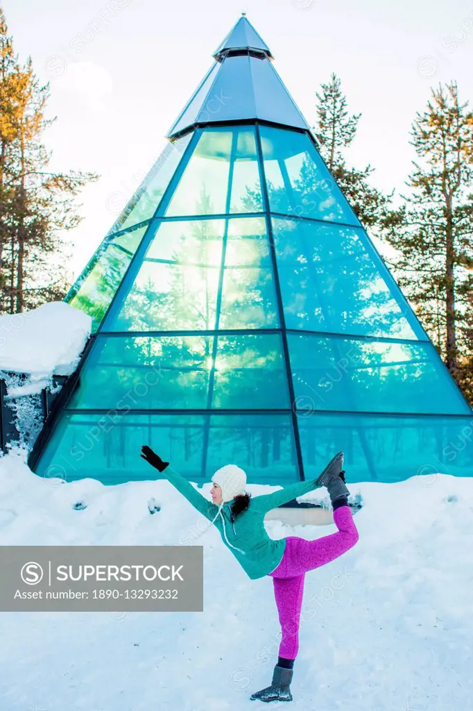 Woman doing yoga, glass teepee, Kakslauttanen Igloo Village, Saariselka, Finland, Scandinavia, Europe