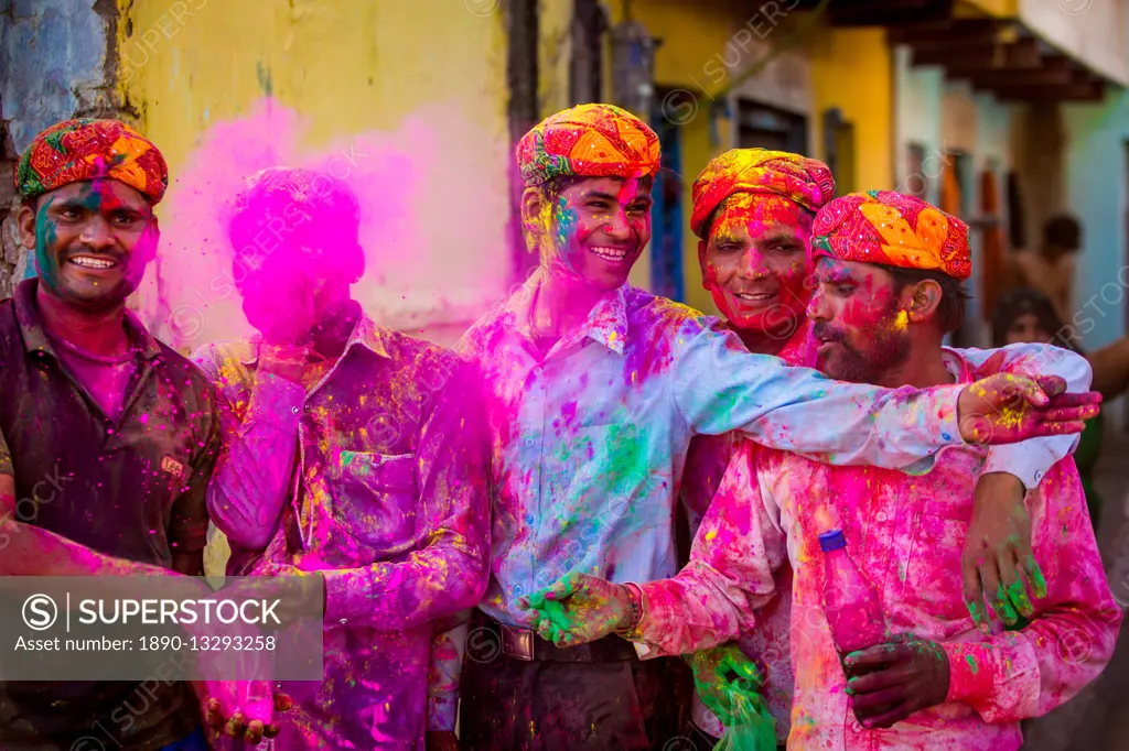 Men throwing colored pigment, Holi Festival, Vrindavan, Uttar Pradesh, India, Asia