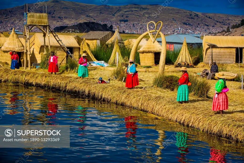 Quechua Indian family on Floating Grass islands of Uros, Lake Titicaca, Peru, South America