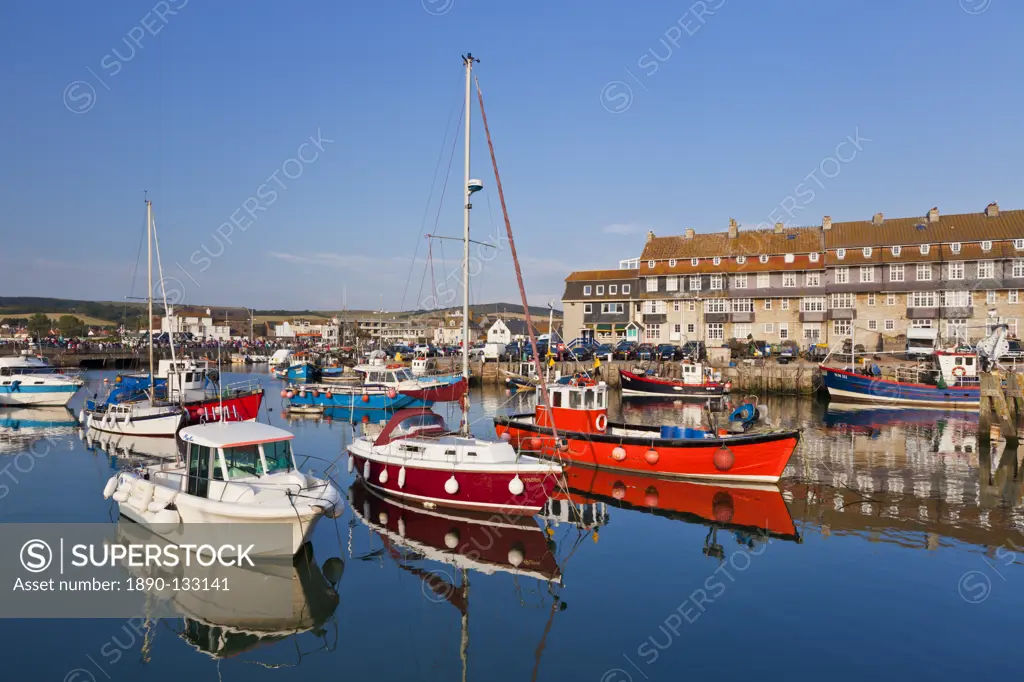 West Bay harbour with yachts and fishing boats, Bridport, gateway town for the Jurassic Coast, UNESCO World Heritage Site, Dorset, England, United Kin...