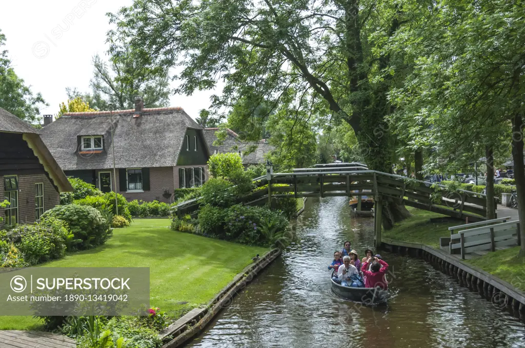 Tourists on the canal at Giethorn, Holland, Europe