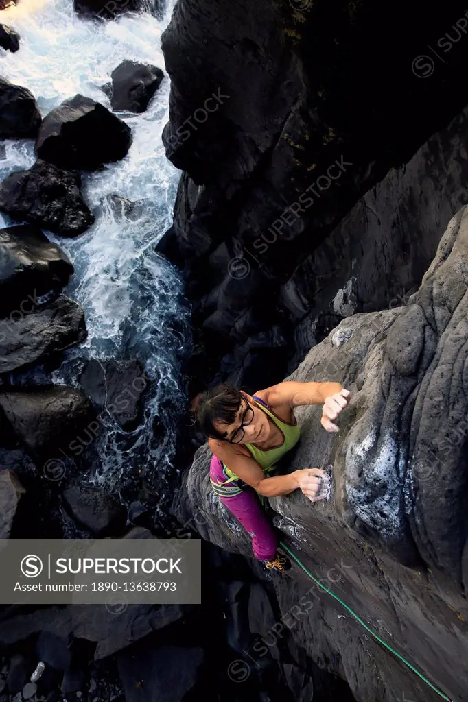 A woman rock climbing on the Jogasaki Coast, Izu Peninsula, Honshu, Japan, Asia