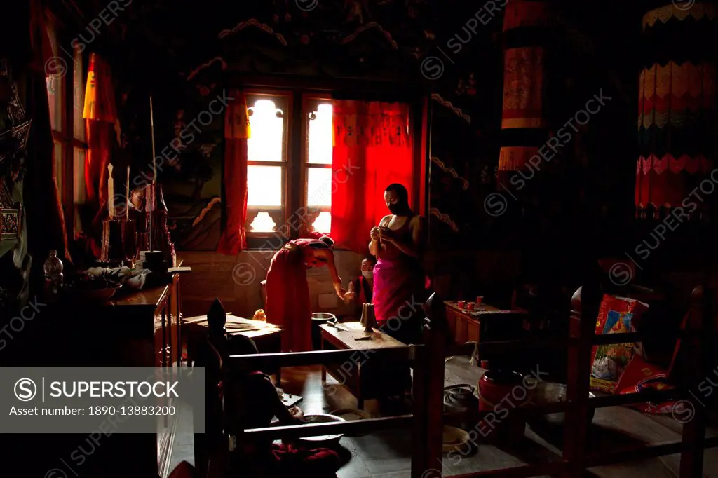 Buddhist monks from Bhutan make candles in their Bhutan Temple in Bodh Gaya, Bihar, India, Asia