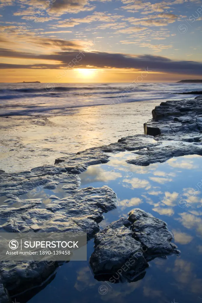 Sunrise over Bamburgh Beach in winter, Northumberland, England, United Kingdom, Europe