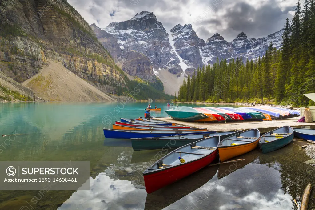 Tranquil setting of rowing boats on Moraine Lake, Banff National Park, UNESCO World Heritage Site, Canadian Rockies Alberta, Canada, North America