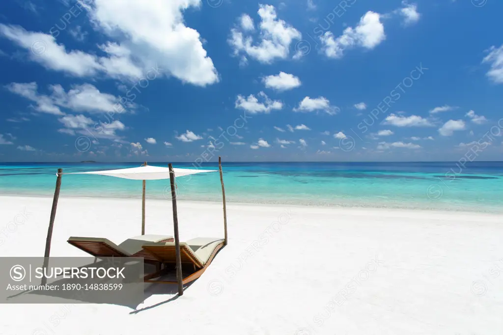 Lounge chairs on tropical white sandy beach, The Maldives, Indian Ocean, Asia