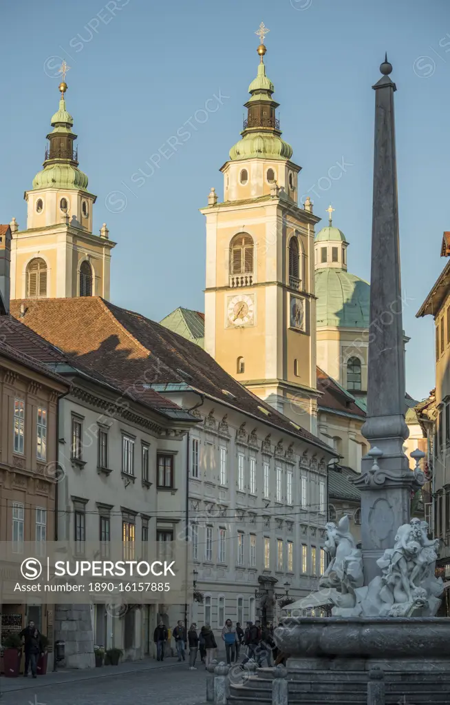 Obelisk and Fountain of the Carnia rivers and St. Nikolaus Church, Old Town, Ljubljana, Slovenia, Europe